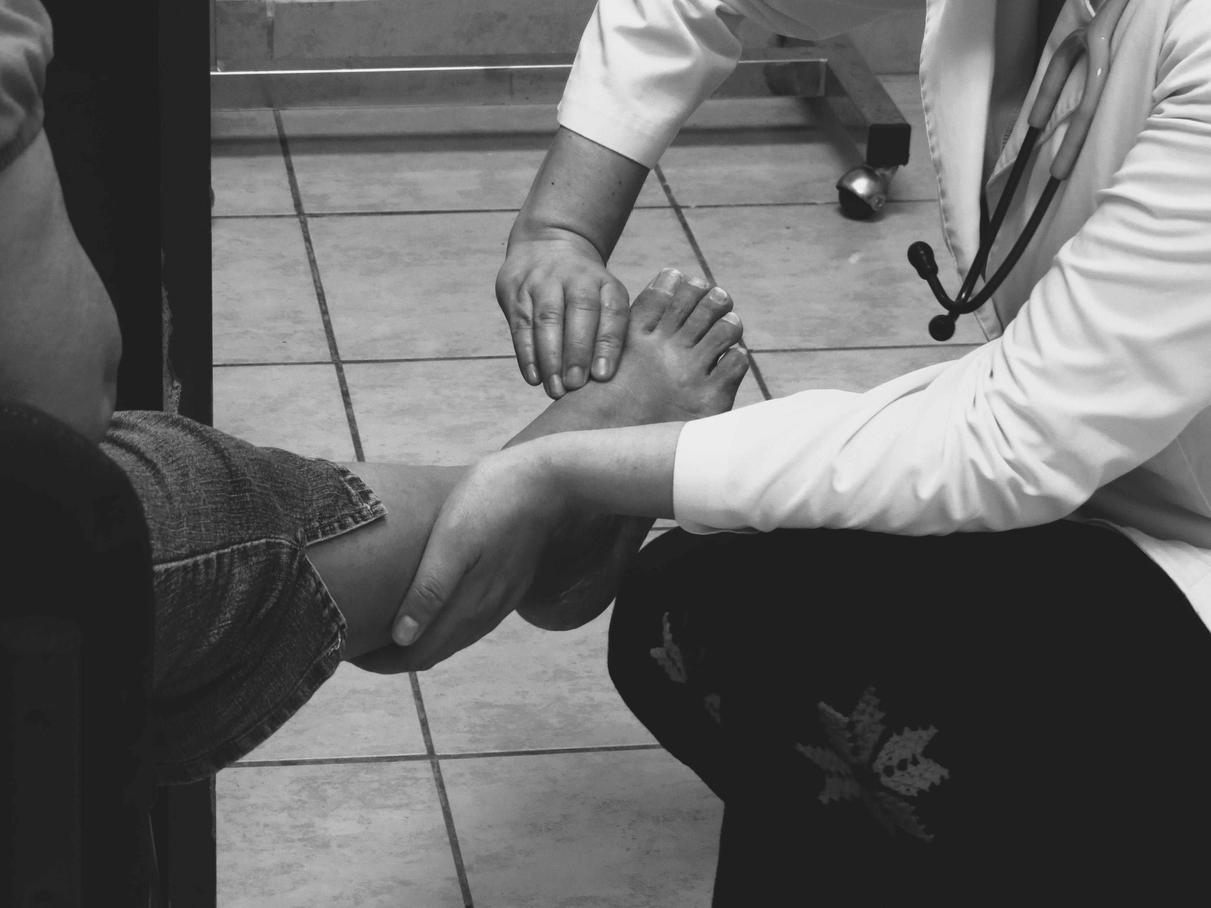 Doctor examining feet